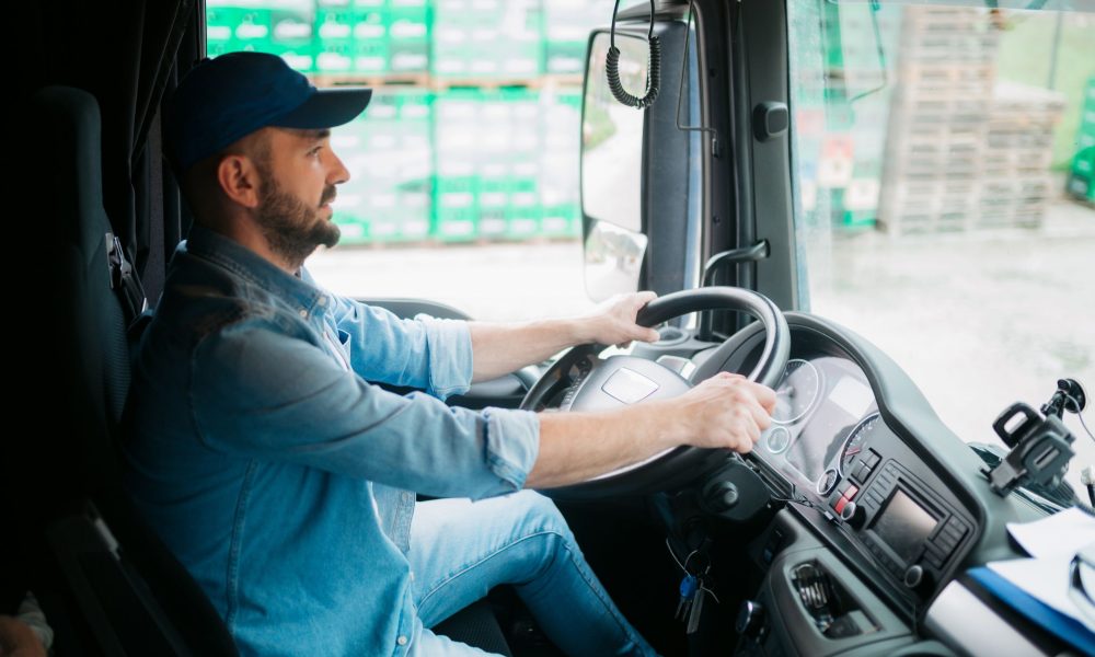A truck driver communicating with an independent dispatcher